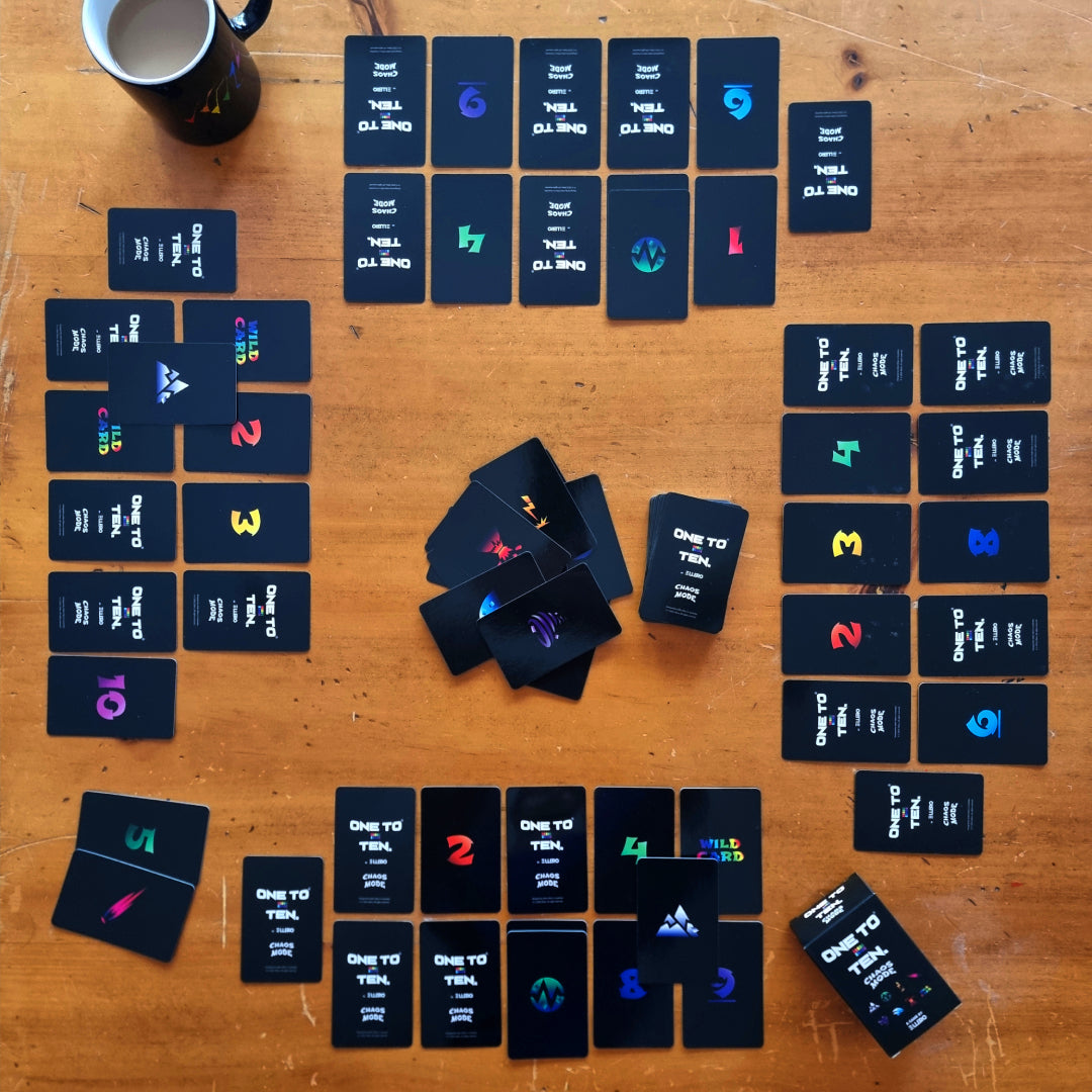 The Chaos Mode version of ONE TO TEN the card game. Black cards on a table.